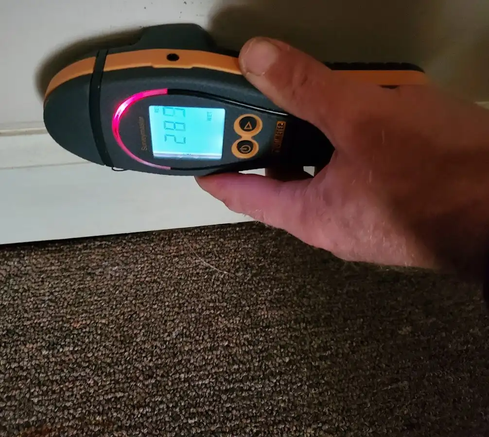 Moisture detection at baseboard during Storm Damage Restoration in Tumwater